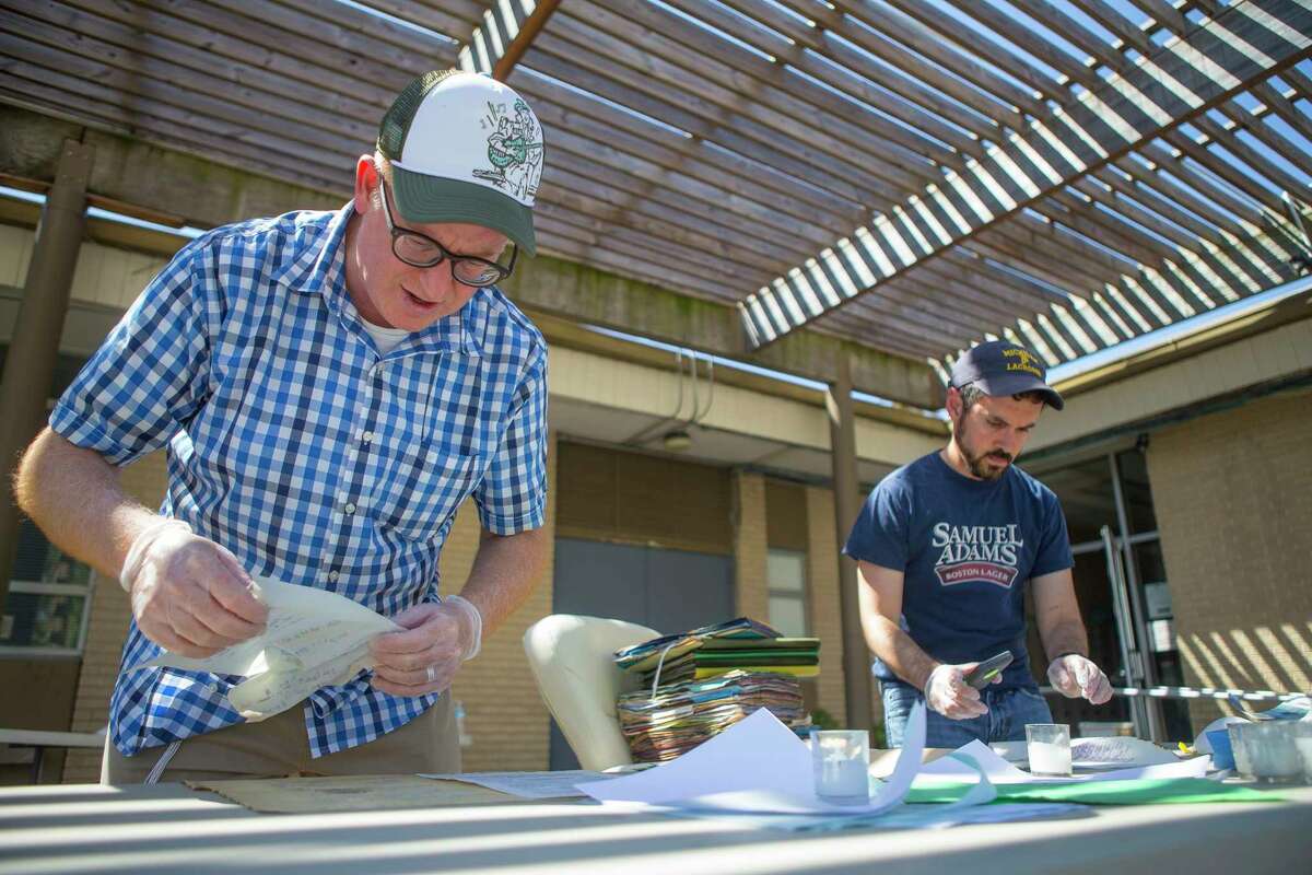 United Orthodox Synagogues Rabbi Barry Gelman (left) and Josh Furman (right), a congregant and local historian, go through flooded files containing important records that were completely submerged in the Rabbi's office , Thursday, September 7, 2017. The synagogue on Greenwillow Street near Brays Bayou was flooded with multiple feet of water. Repairs are underway inside the building.