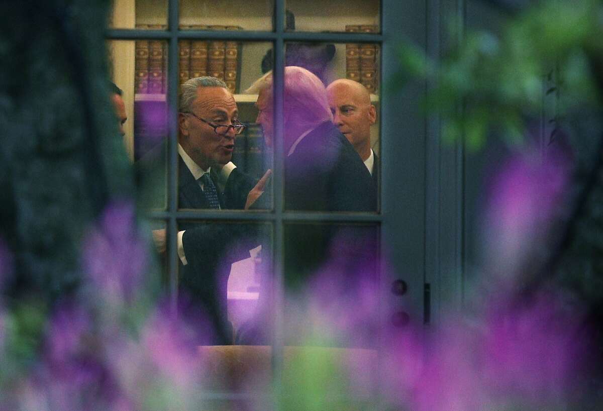 WASHINGTON, DC - SEPTEMBER 06: U.S. Senate Minority Leader Chuck Schumer (D-NY) (L) makes a point to President Donald Trump in the Oval Office prior to his departure from the White House September 6, 2017 in Washington, DC. President Trump is traveling to North Dakota for a tax reform event with workers from the energy sector. (Photo by Alex Wong/Getty Images) *** BESTPIX ***