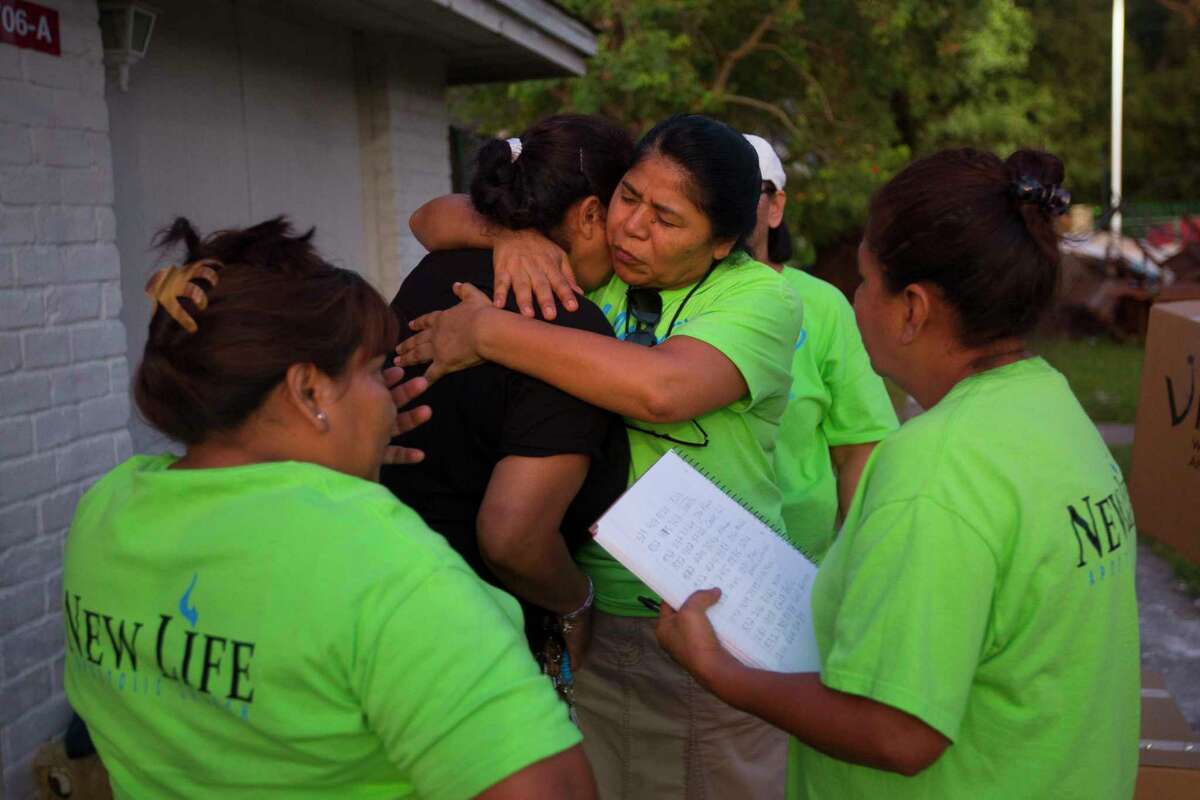 Emigdia G. Llmas hugs flood victim Berta Gomez while giving out supplies with fellow members of New Life Church in the Northshore neighborhood of Houston, Wednesday, September 6, 2017. Gomez escaped her apartment with her husband, 76-year-old mother and five-year-old daughter by wading through neck-deep water with helicopters flying overhead pointing the direction to go. She is currently waiting for a FEMA housing voucher to come through, but the process is taking a long time, she said. She is worried about her mother and daughter getting sick staying in their home.