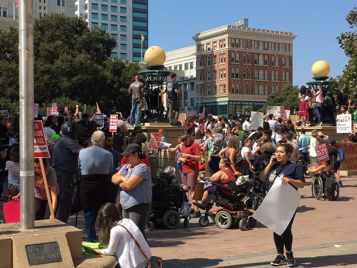 Hundreds of demonstrators fill Frank H. Ogawa Plaza in downtown Oakland to protest President Trump’s decision to phase out an executive order that had protected from deportation many young adults who were brought to the U.S. by their undocumented parents.