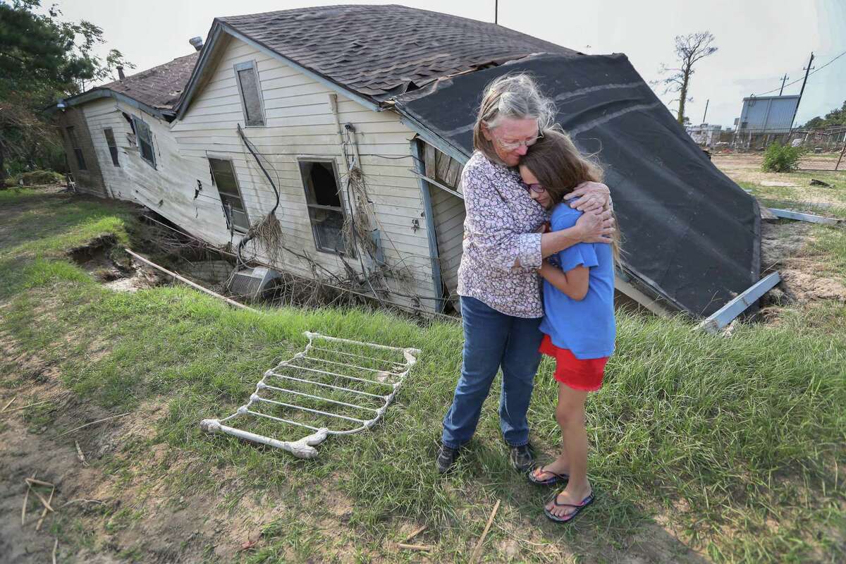 ﻿Linda Bonner, 71, embraces her granddaughter Gaige-Lyn Gray in front of ther home in Channelview, about a mile away from the San Jacinto Waste pits and destroyed by Hurricane Harvey. She does not plan to rebuild her home of nearly 40 years. ﻿﻿