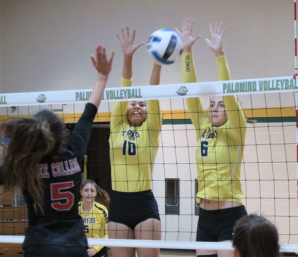 Karlee Lynd and Emily Morley defend for the Lady Palominos as they battle Lee College in s conference volleyball game Saturday, September 9, 2017 at the Maravillo Gym at the LCC Fort McIntosh Campus.