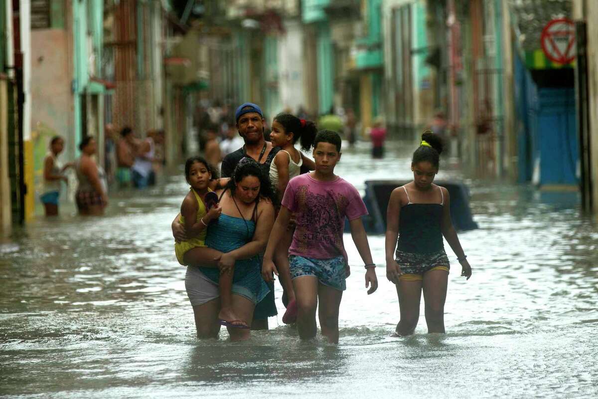 Waves crash into El Morro after the passing of Hurricane Irma, in Havana, Cuba, Sunday, Sept. 10, 2017. The powerful storm ripped roofs off houses, collapsed buildings and flooded hundreds of miles of coastline after cutting a trail of destruction across the Caribbean.There were no immediate reports of deaths in Cuba, a country that prides itself on its disaster preparedness, but authorities were trying to restore power and clear roads. (AP Photo/Ramon Espinosa)