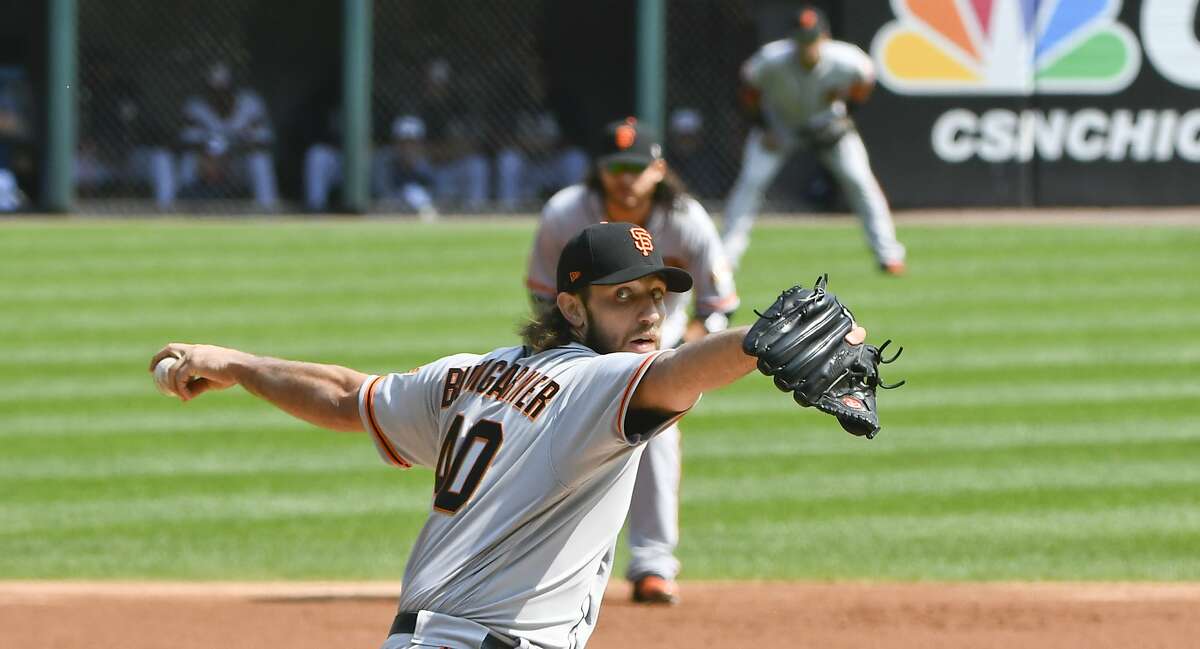 San Francisco Giants starting pitcher Madison Bumgarner (40) delivers against the Chicago White Sox during the first inning of a baseball game in Chicago, Sunday, Sept. 10, 2017. (AP Photo/Matt Marton)