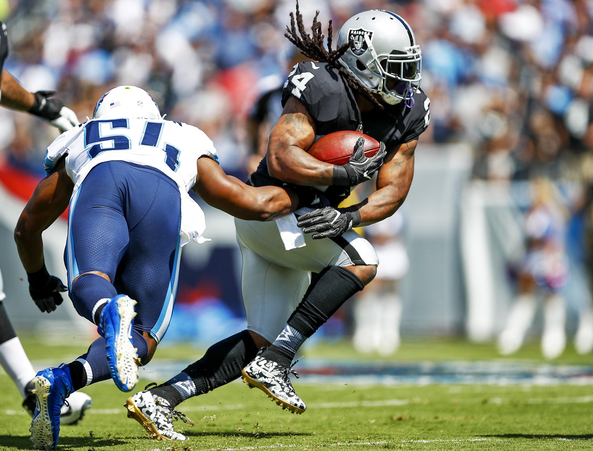 Marshawn Lynch goes full Beast Mode as he runs over 305-pound Titans tackle