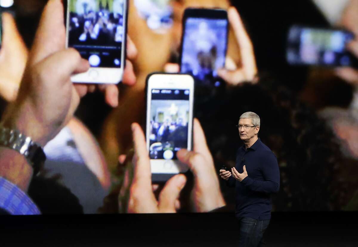 FILE - In this Wednesday, Sept. 7, 2016, file photo, Apple CEO Tim Cook announces the new iPhone 7 during an event to announce new products, in San Francisco. Apple is expected to demand $1,000 for the fanciest iPhone that it has ever made, thrusting the market into a new financial frontier that will test how much consumers are willing to pay for a device that has become an indispensable part of modern life. The unveiling of the dramatically redesigned iPhone will likely be the marquee moment Tuesday, Sept. Sept. 12 when Apple hosts its first event at its new Cupertino, Calif., headquarters. (AP Photo/Marcio Jose Sanchez, File)