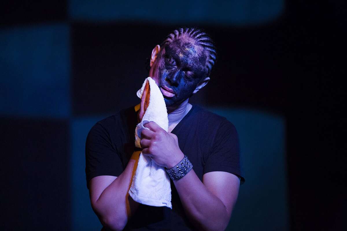 Dazie Grego-Sykes wipes the black paint from his face in his performance "Nigga-Roo" during the Fringe Festival at the EXIT Theatre on Sept. 9, 2017.