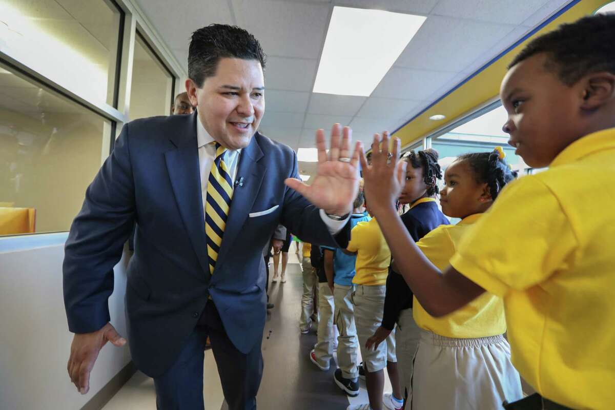 Houston ISD Superintendent Richard Carranza gives "High-Fives" to students at Codwell Elementary Monday, Sept. 11, 2017, in Houston. Carranza visited the campus on the first day of school as hundreds of thousands of Houston area students have returned to their campuses since Hurricane Harvey devastated the region beginning on Aug. 26.