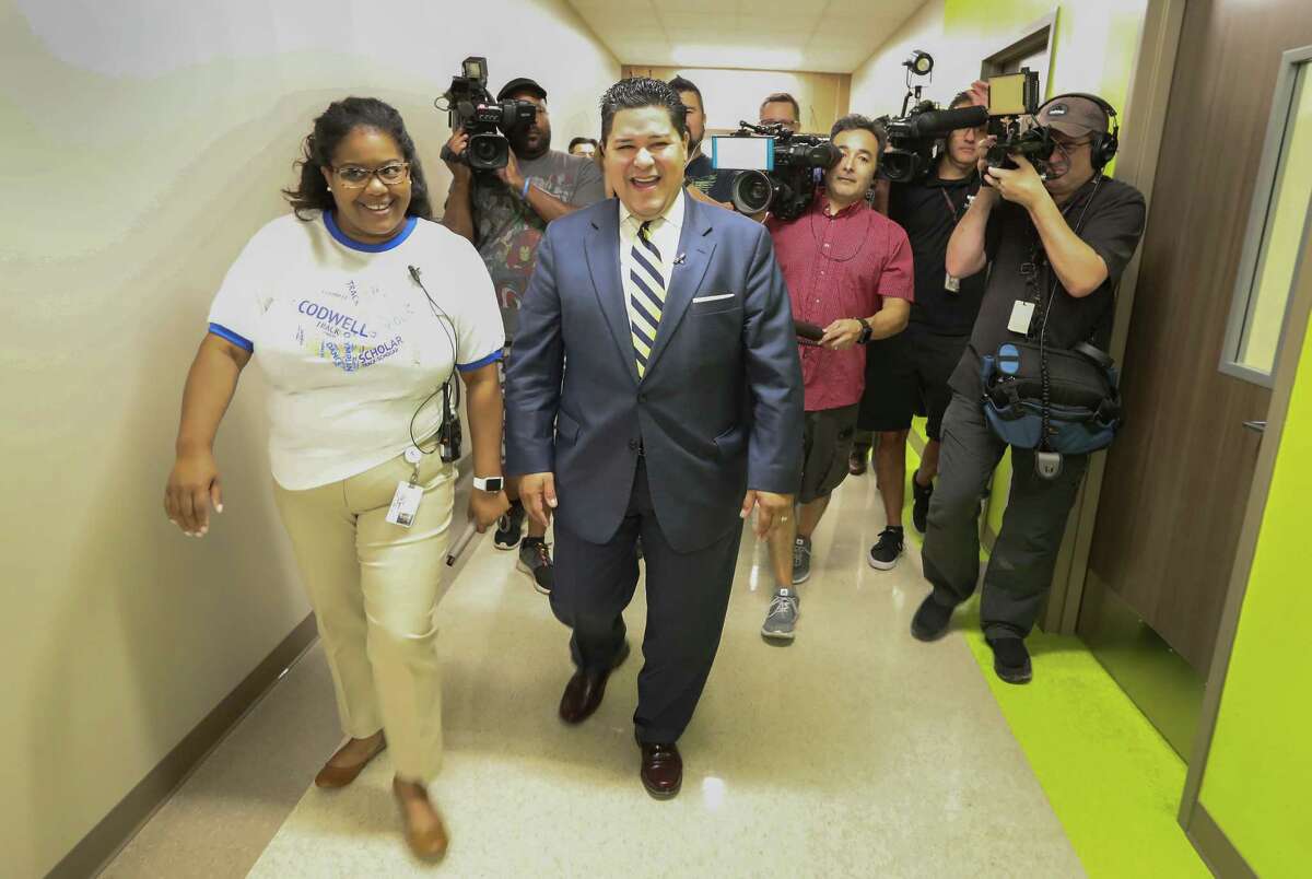 Principal Kristy Love gives Houston ISD Superintendent Richard Carranza a tour of Codwell Elementary Monday, Sept. 11, 2017, in Houston. Carranza visited the campus on the first day of school as hundreds of thousands of Houston area students have returned to their campuses since Hurricane Harvey devastated the region beginning on Aug. 26.