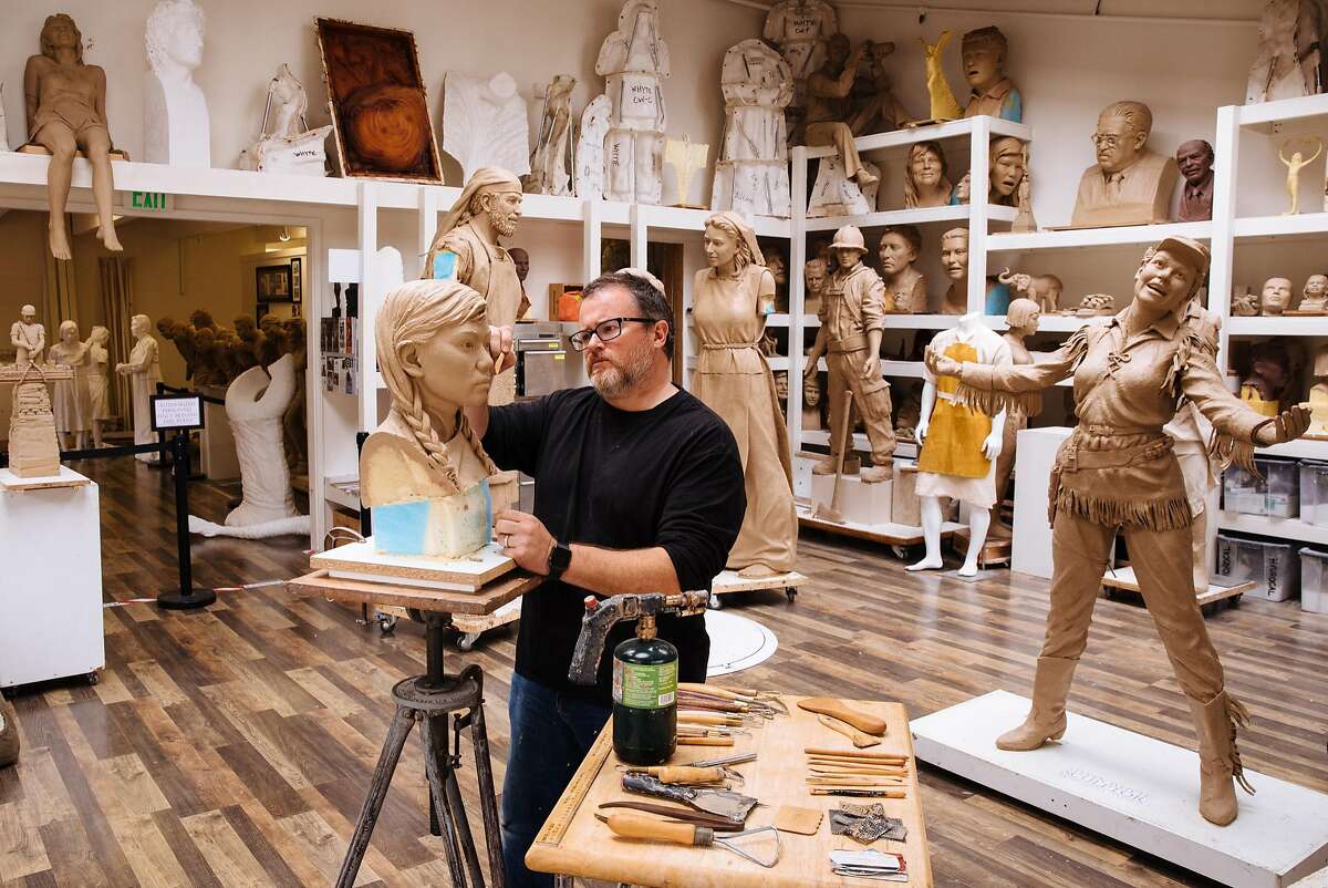 Sculptor Steven Whyte works on the face of one of the girls in the 'Women�s Column of Strength' memorial in his studio in Carmel, Calif. Friday, September 8, 2017.