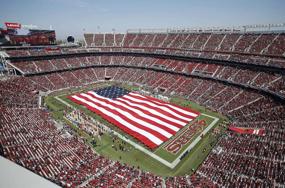 A large flag is presented at Levi's Stadium during the national anthem before an NFL football game between the San Francisco 49ers and the Carolina Panthers in Santa Clara, Calif., Sunday, Sept. 10, 2017. (AP Photo/Tony Avelar)