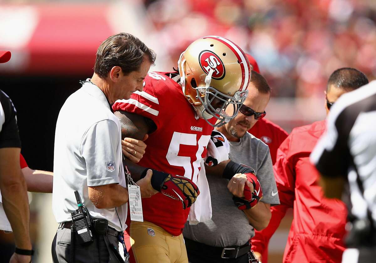 SANTA CLARA, CA - SEPTEMBER 10: Reuben Foster #56 of the San Francisco 49ers is helped off the field after he was injured in their game against the Carolina Panthers at Levi's Stadium on September 10, 2017 in Santa Clara, California. (Photo by Ezra Shaw/Getty Images)