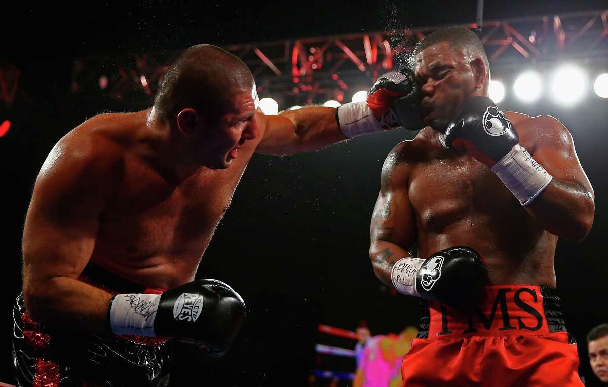 Mike Perez punches Magomed Abdusalamov during their Heavyweight fight at The Theater at Madison Square Garden on November 2, 2013, in New York City. (Photo by Al Bello/Getty Images)  