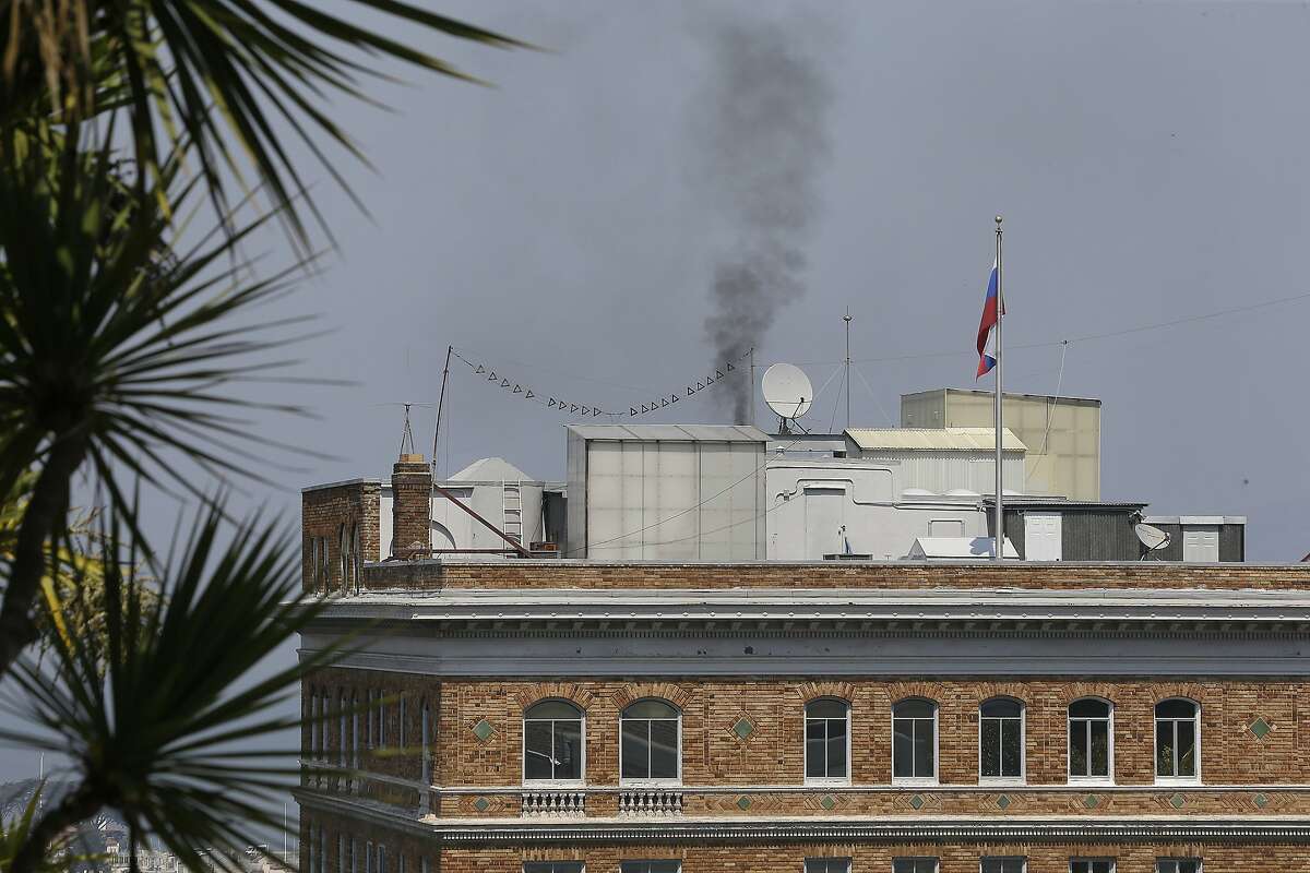 In this photo taken Sept. 1, 2017, black smoke rises from the roof at the Consulate-General of Russia in San Francisco. San Francisco's air board is citing Russian diplomats over the mysterious black smoke that wafted out of their consulate here in the hours after the United States ordered it shut down. (AP Photo/Eric Risberg)