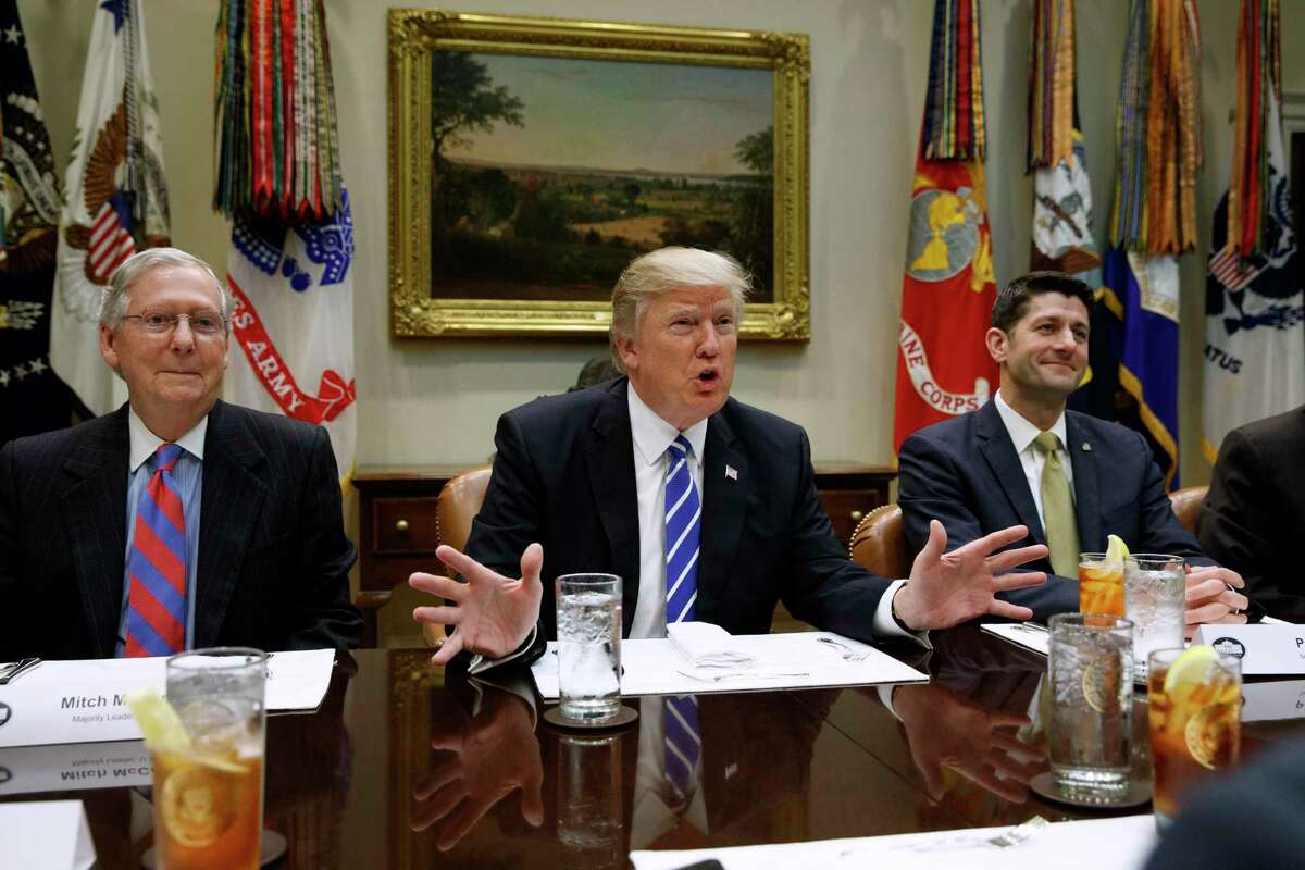 FILE - In this March 1, 2017 file photo, President Donald Trump, flanked by Senate Majority Leader Mitch McConnell of Ky., left, and House Speaker Paul Ryan of Wis., speaks during a meeting with House and Senate leadership, in the Roosevelt Room of the White House in Washington. Repeal and replace âObamacare.â Just repeal. Or let it fail _ maybe with a little nudge. President Donald Trump has sent a flurry of mixed messages, raising questions about the White House strategy on health care. (AP Photo/Evan Vucci, File)