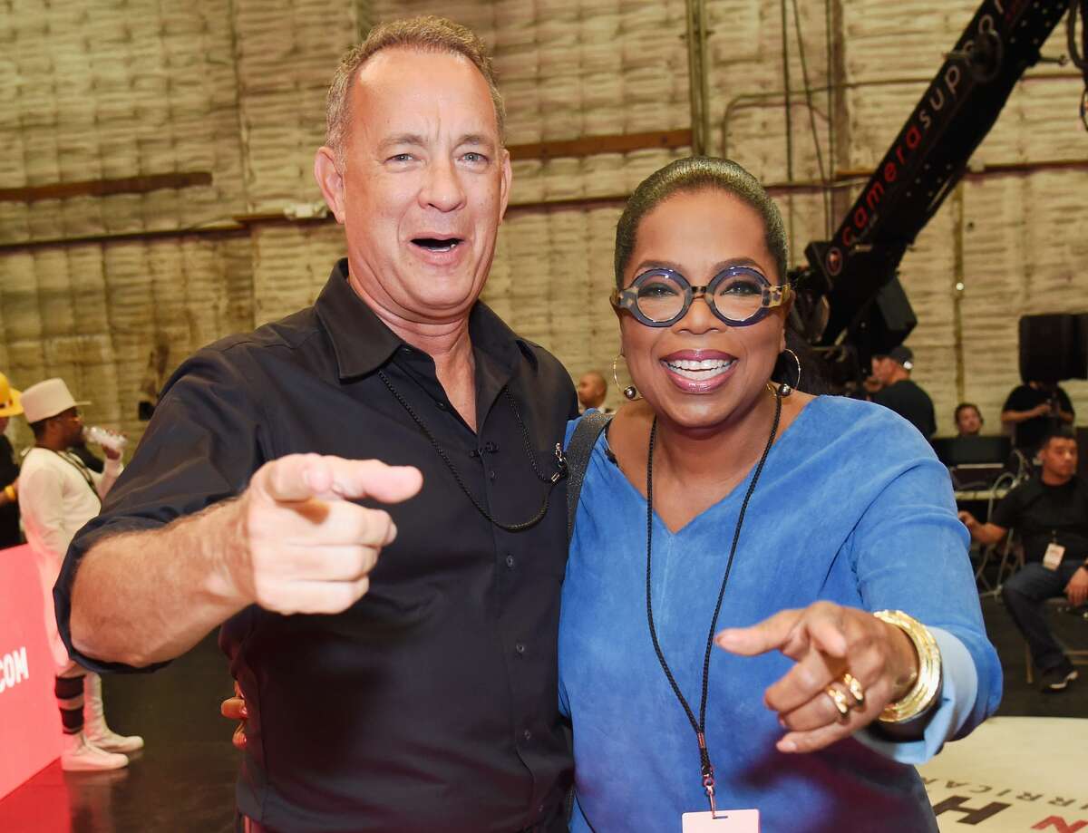 UNIVERSAL CITY, CA - SEPTEMBER 12: In this handout photo provided by Hand in Hand, Tom Hanks and Oprah Winfrey attend Hand in Hand: A Benefit for Hurricane Relief at Universal Studios AMC on September 12, 2017 in Universal City, California. (Photo by Kevin Mazur/Hand in Hand/Getty Images)