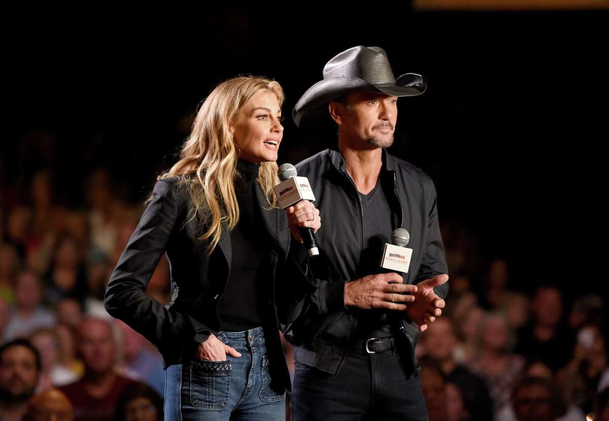 NASHVILLE, TN - SEPTEMBER 12: In this handout photo provided by Hand in Hand, Faith Hill and Tim McGraw speak onstage during Hand in Hand: A Benefit for Hurricane Relief at the Grand Ole Opry House on September 12, 2017 in Nashville, Tennessee.