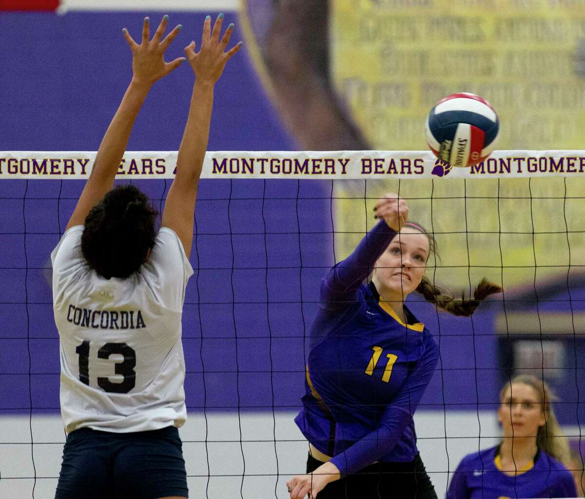 Montgomery middle blocker Mallory Talbert (11) scores a point during the second set of a non-district high school volleyball match at Montgomery High School, Tuesday, Sept. 12, 2017.
