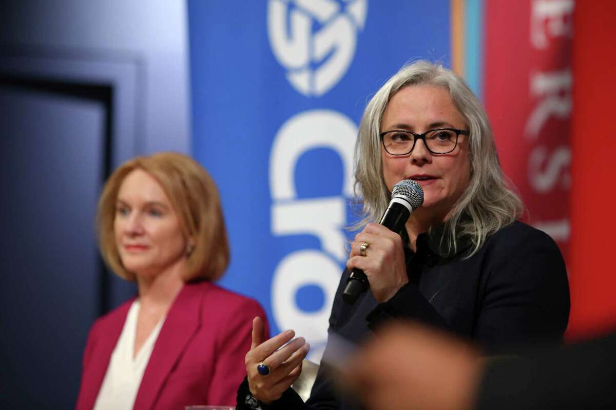 Mayoral candidates Jenny Durkan, left, and Cary Moon answer questions during a debate. They have been seeing a lot of each other, competing for endorsements from one end of the city to the other.