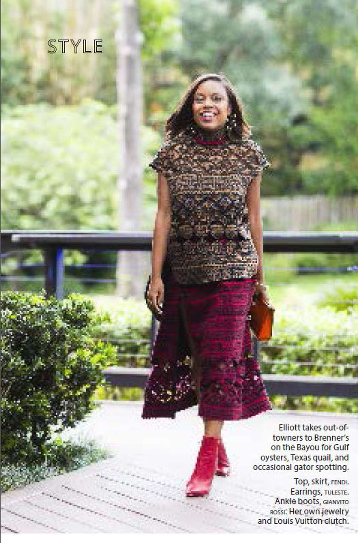 Amber Elliott wears a Fendi skirt and carries a Louis Vuitton clutch in this photo in Elle magazine.