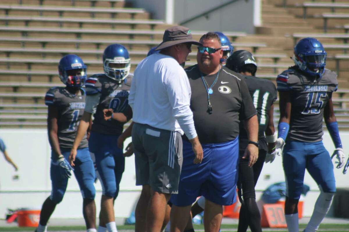 Memorial head coach Chris Quillian and Dickinson coach John Snelson chat after last Friday's scrimmage. Quillian celebrates his sixth opener this weekend.