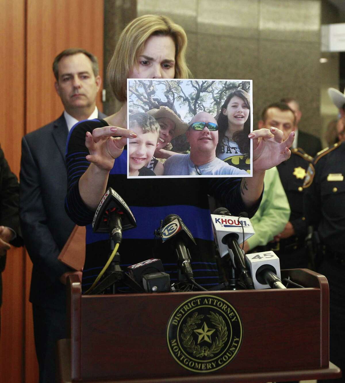 Kathleen Goforth, widow of Harris County SheriffÂ?’s Deputy Darren Goforth, shows photos of her family during a press conference at the Harris County Civil Courthouse, Wednesday, Sept. 13, 2017, in Houston. Shannon Miles, 32, pleaded guilty to capital murder and was sentenced to life without parole for fatally shooting her husband on Aug. 28, 2015, as he was filling up his patrol car at a gas station in Northeast Harris County.