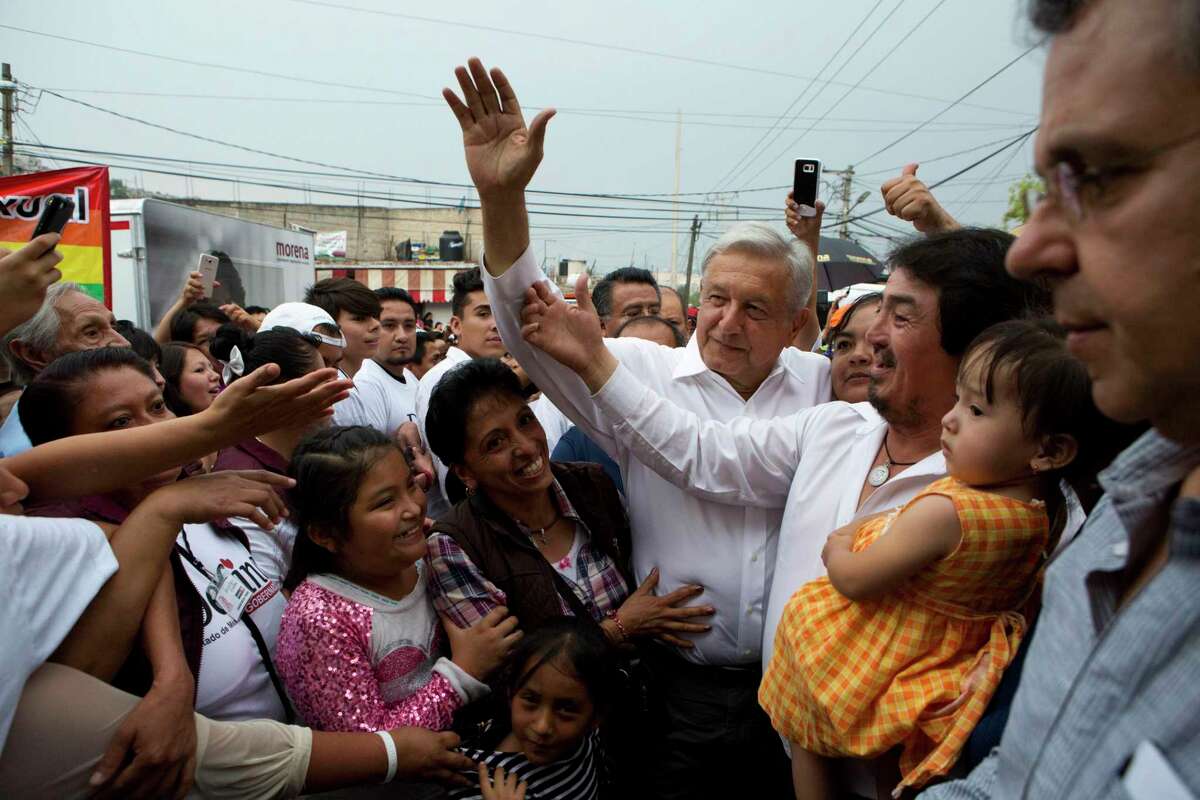 Andres Manuel Lopez Obrador, with white hair, is a front-runner to become Mexico's president.﻿
