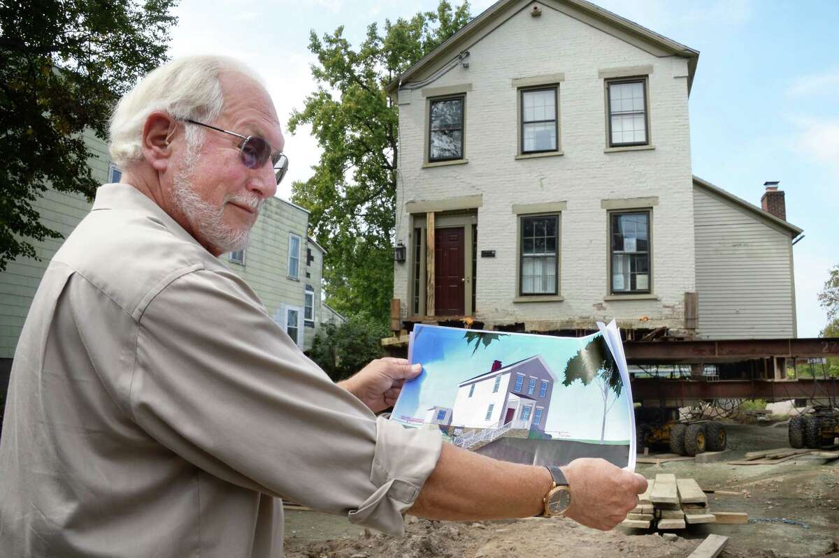 Architect Frank Gilmore shows his design for raising and moving this historic Stockade home out of the flood plain Wednesday Sept. 13, 2017 in Schenectady, NY. An $8.6 million FEMA grant to study how to help other historic homes that are in the flood plain is on hold following Hurricanes Harvey and Irma. (John Carl D'Annibale / Times Union)