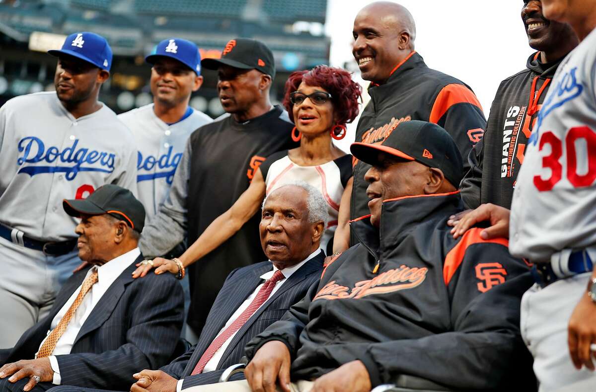 San Francisco Giants' legends Willie Mays, Frank Robinson and Willie McCovey pose with Barry Bonds and other players and dignitaries on African American Heritage Night before Giants play Los Angeles Dodgers in MLB game at AT&T Park in San Francisco, Calif., on Wednesday, September 13, 2017.