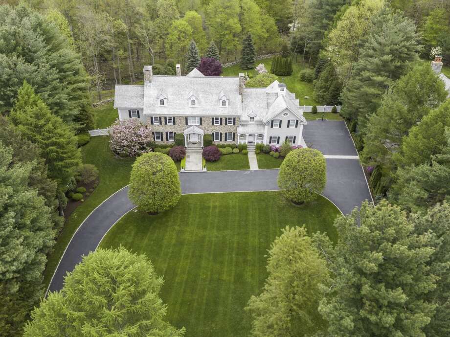 On the Market / Stone and clapboard home on over two landscaped acres