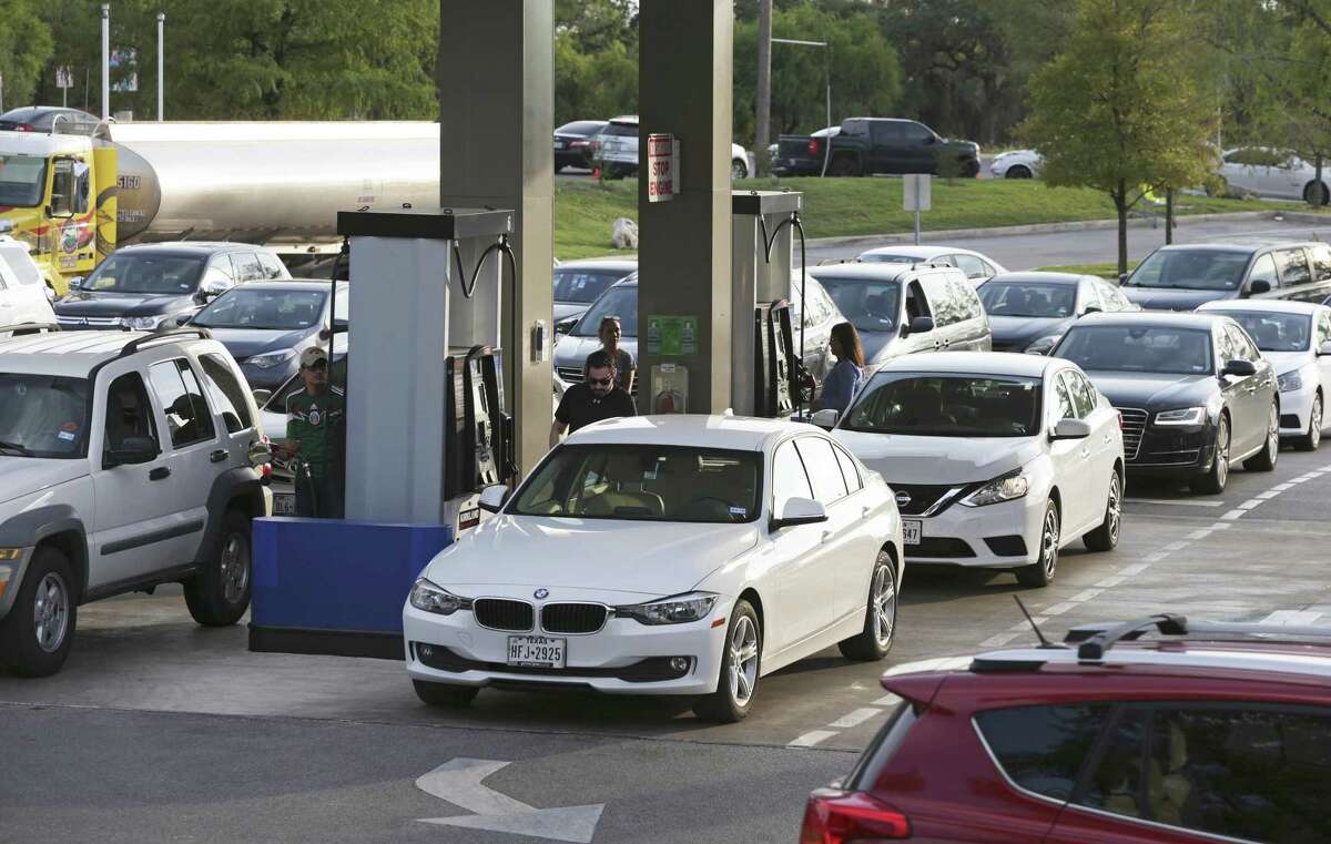 Drivers in San Antonio fill up on Sept. 5 as long lines caused by gas shortages plagued the city. Fuel prices fell for the first time since Hurricane Harvey hit Texas, according to AAA.