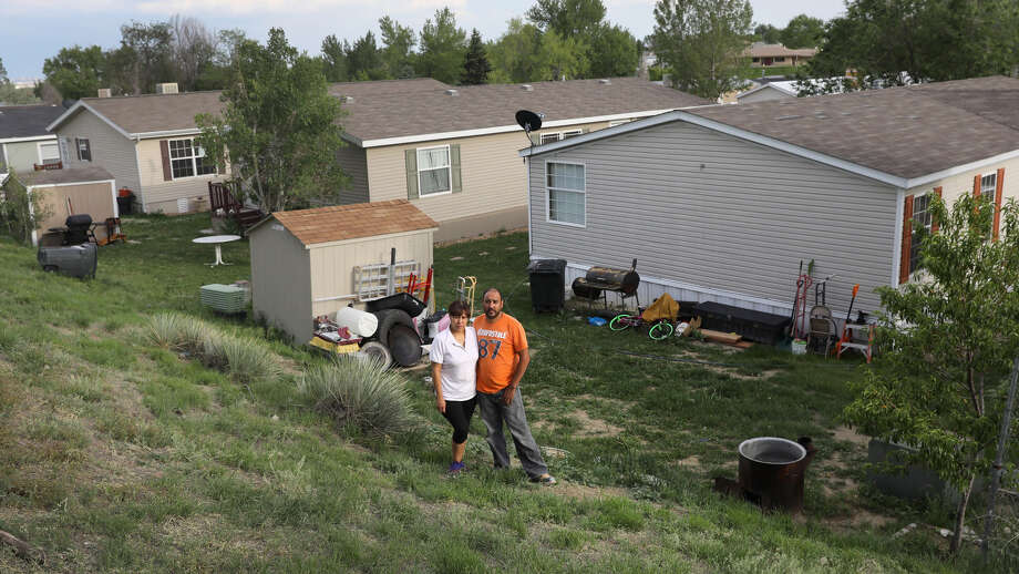 Mexican immigrants outside their family home in Thornton, CO Photo: John Moore/Getty Images