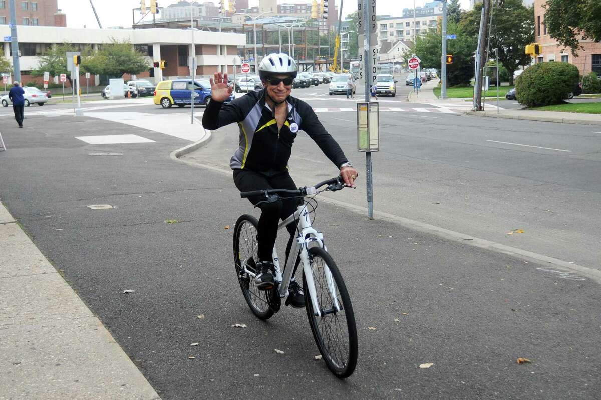 Republican candidate for mayor Barry Michelson bikes with during a "Cycling with Candidates" event in downtown Stamford.