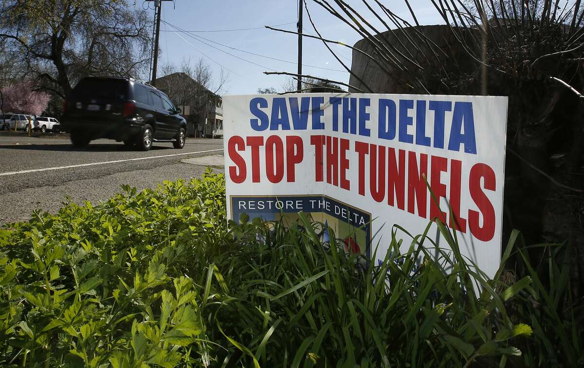 FILE - In this Feb. 23, 2016, file photo, a sign opposing a proposed tunnel plan to ship water through the Sacramento-San Joaquin Delta to Southern California is displayed near Freeport, Calif. Northern California cities and counties are going to court to block what could be the state's costliest water project in history. Stockton on Friday, Aug. 18, 2017, joined Sacramento County in suing the state over Gov. Jerry Brown's plans for two giant water tunnels. The $17 billion tunnels would divert part of the Sacramento River into massive underground pipes for cities and farms to the south and west. (AP Photo/Rich Pedroncelli, File)