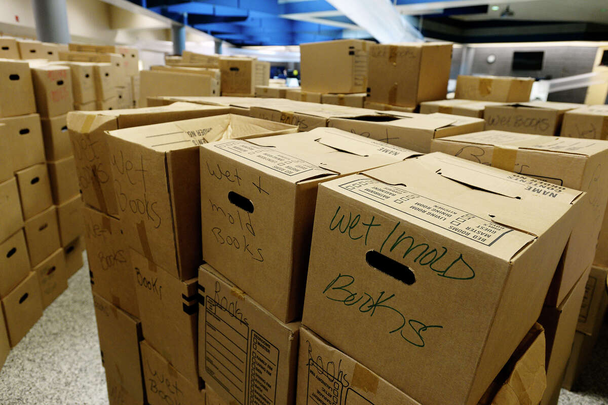 Boxes of damaged books at Vidor Middle School on Thursday. The school's fifth graders will go to class in a separate wing at Vidor High School, and the sixth graders will go to the junior high. Photo taken Thursday 9/14/17 Ryan Pelham/The Enterprise
