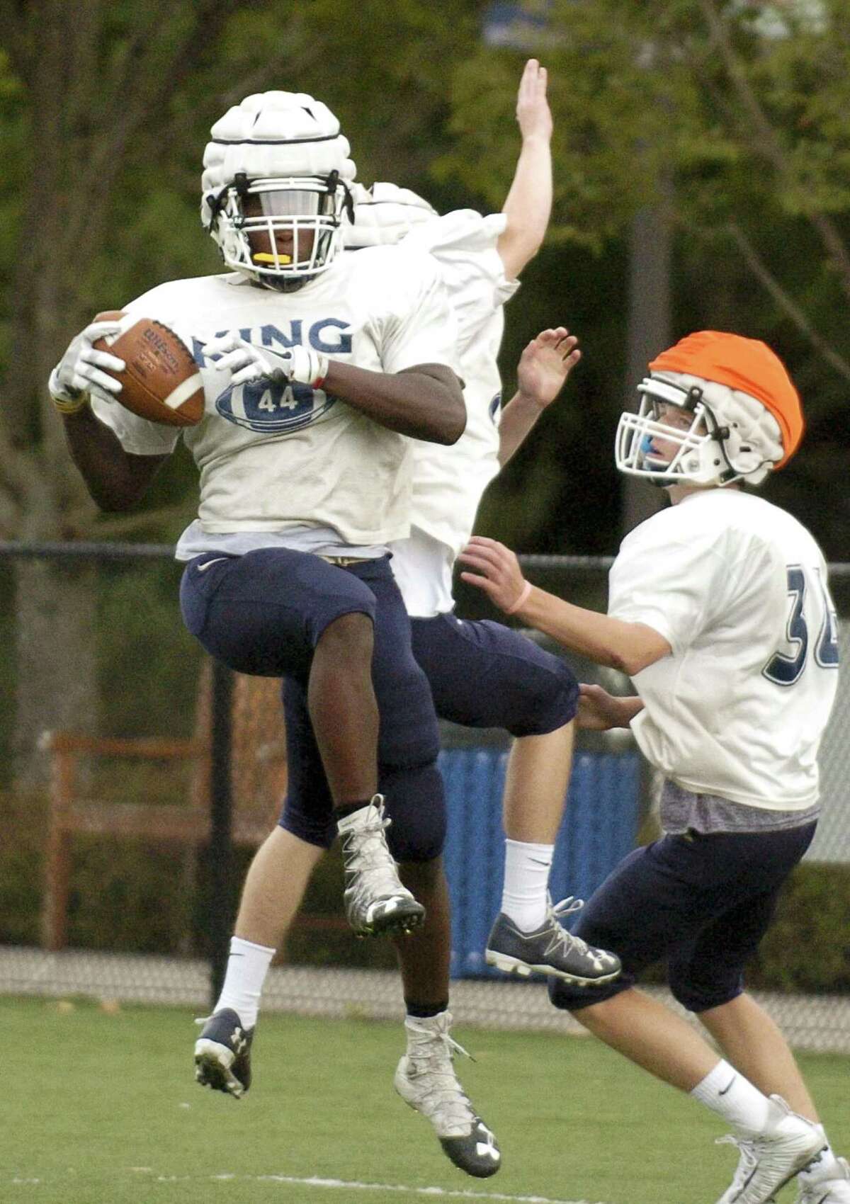 King outside linebacker Levaughn Lewis makes a reception during a practice at the school on Wednesday in Stamford.