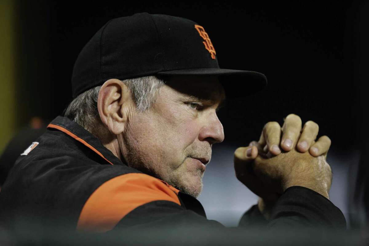 Giants' manager Bruch Bochy (15) watches a game against the Milwaukee Brewers in August.
