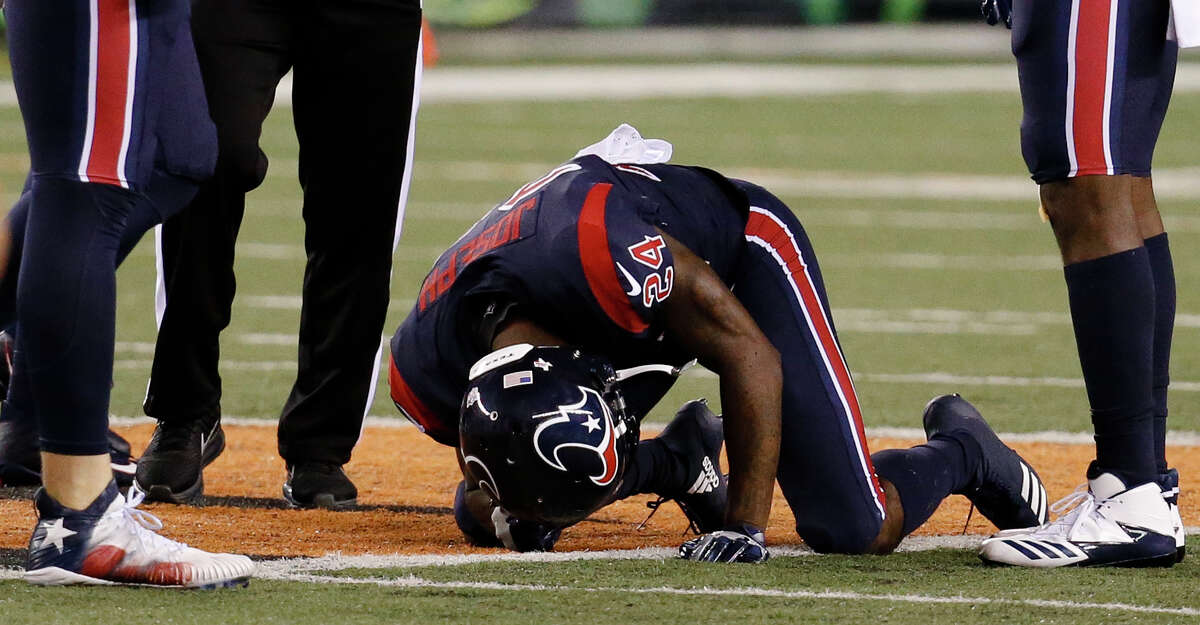 Houston Texans cornerback Johnathan Joseph (24) kneels on the field after an apparent injury in the first half of an NFL football game against the Cincinnati Bengals, Thursday, Sept. 14, 2017, in Cincinnati. (AP Photo/Frank Victores)