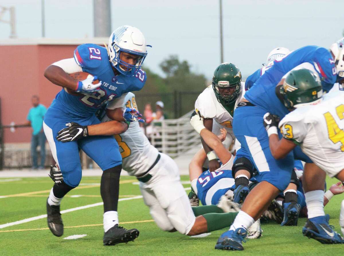 Oak Ridge's Harrison Smith shakes off a tackler against Klein Forest at Woodforest Bank Stadium in Shenandoah.