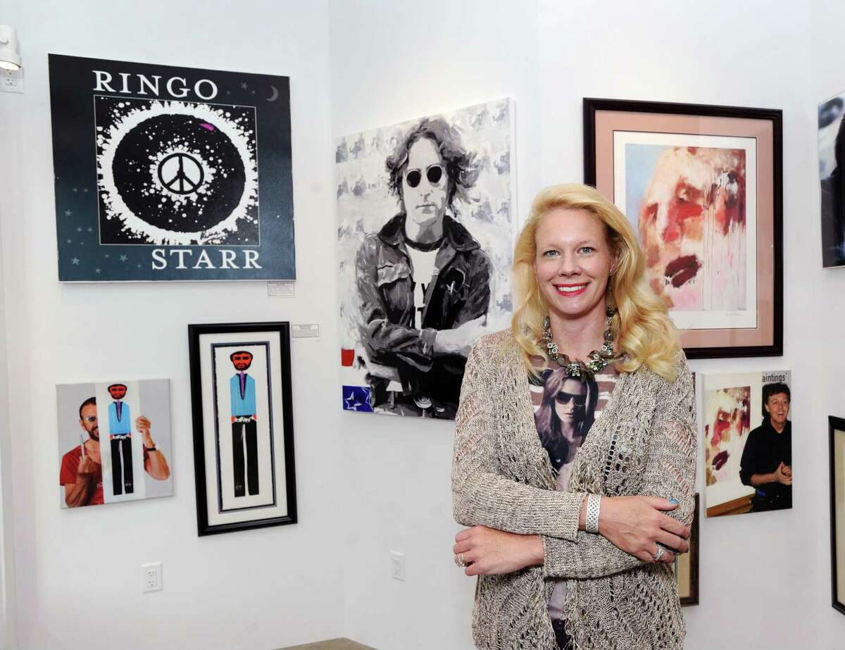 Tiffany Benincasa owner of the C. Parker Art Gallery inside its new Greenwich location at 409 Greenwich Avenue, Greenwich, Conn., Thursday, Sept. 14, 2017. The gallery formerly located on East Putnam Avenue in Greenwich is celebrating its move and grand re-opening with an exhibit featuring hand-signed artwork from John Lennon, Paul McCartney, George Harrison and Ringo Starr as well as works of the Beatles including pieces done by Andy Warhol.