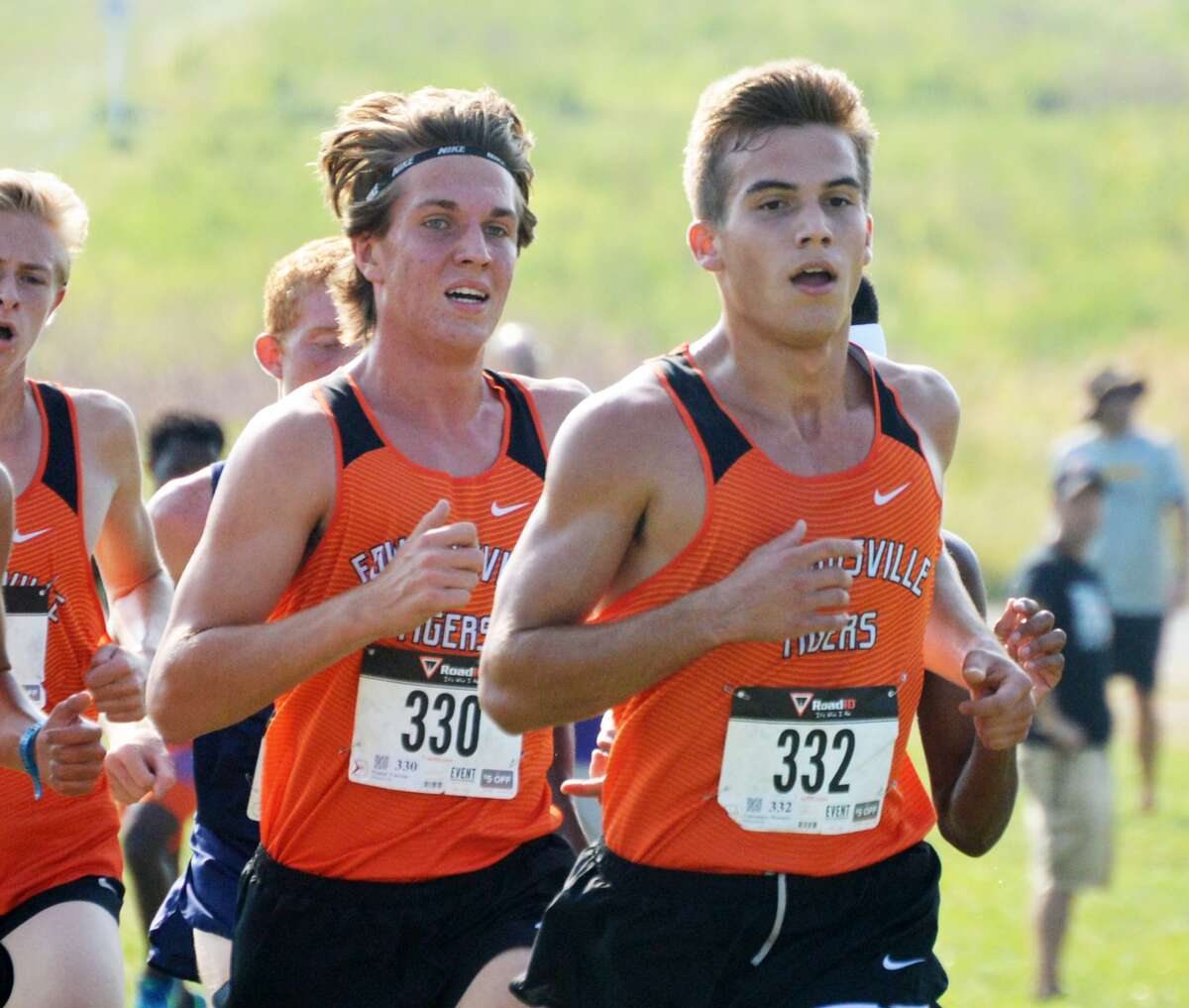 Edwardsville’s Franky Romano, right, and Roland Prenzler run in a pack of Tigers during the Edwardsville Invitational on Saturday at SIUE.