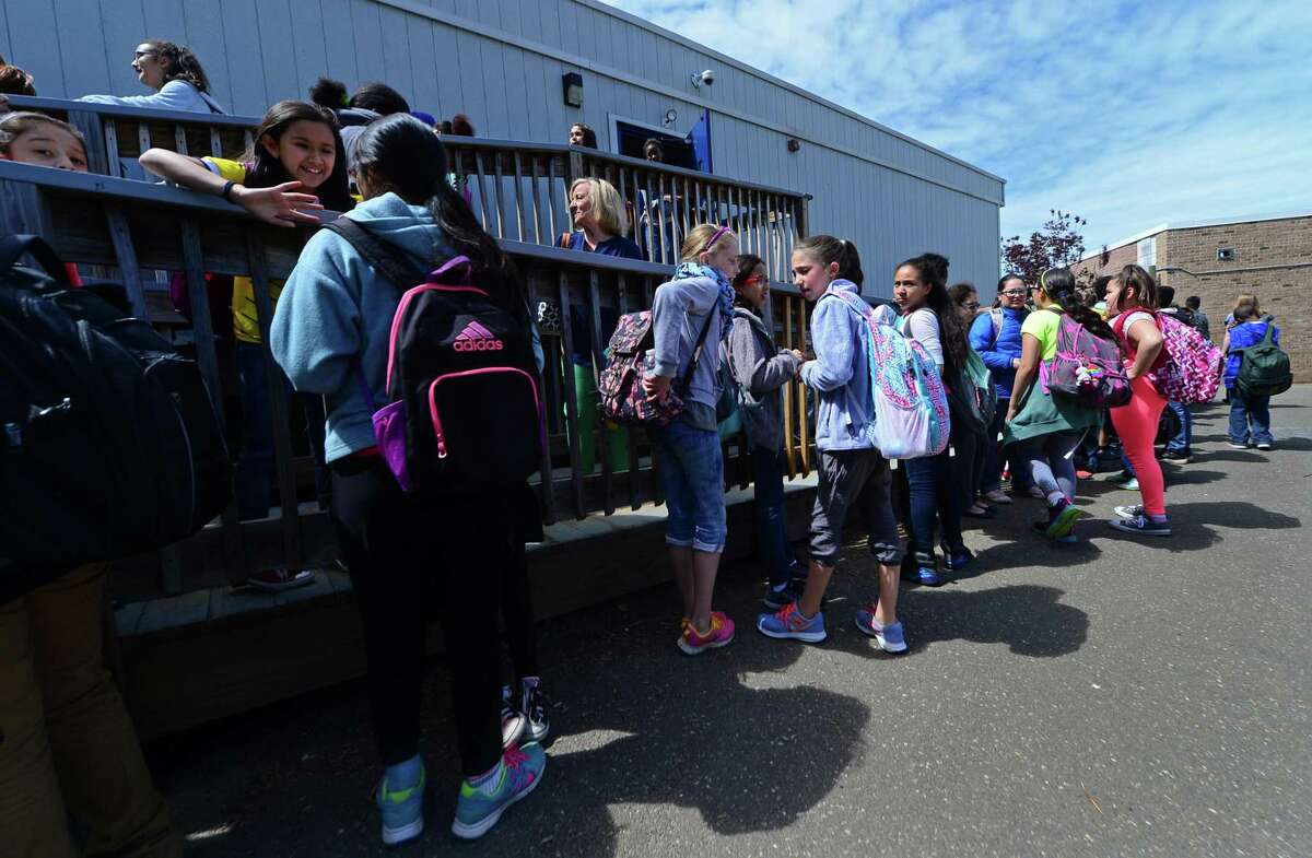 Jefferson Elementary School students exit portable classrooms Wednesday, May 18, 2016. Jefferson has one of the most crowded schools and has 10 classrooms in portables. The over-enrollment of Norwalk Public Schools has led to the use of portable school classrooms at some schools.