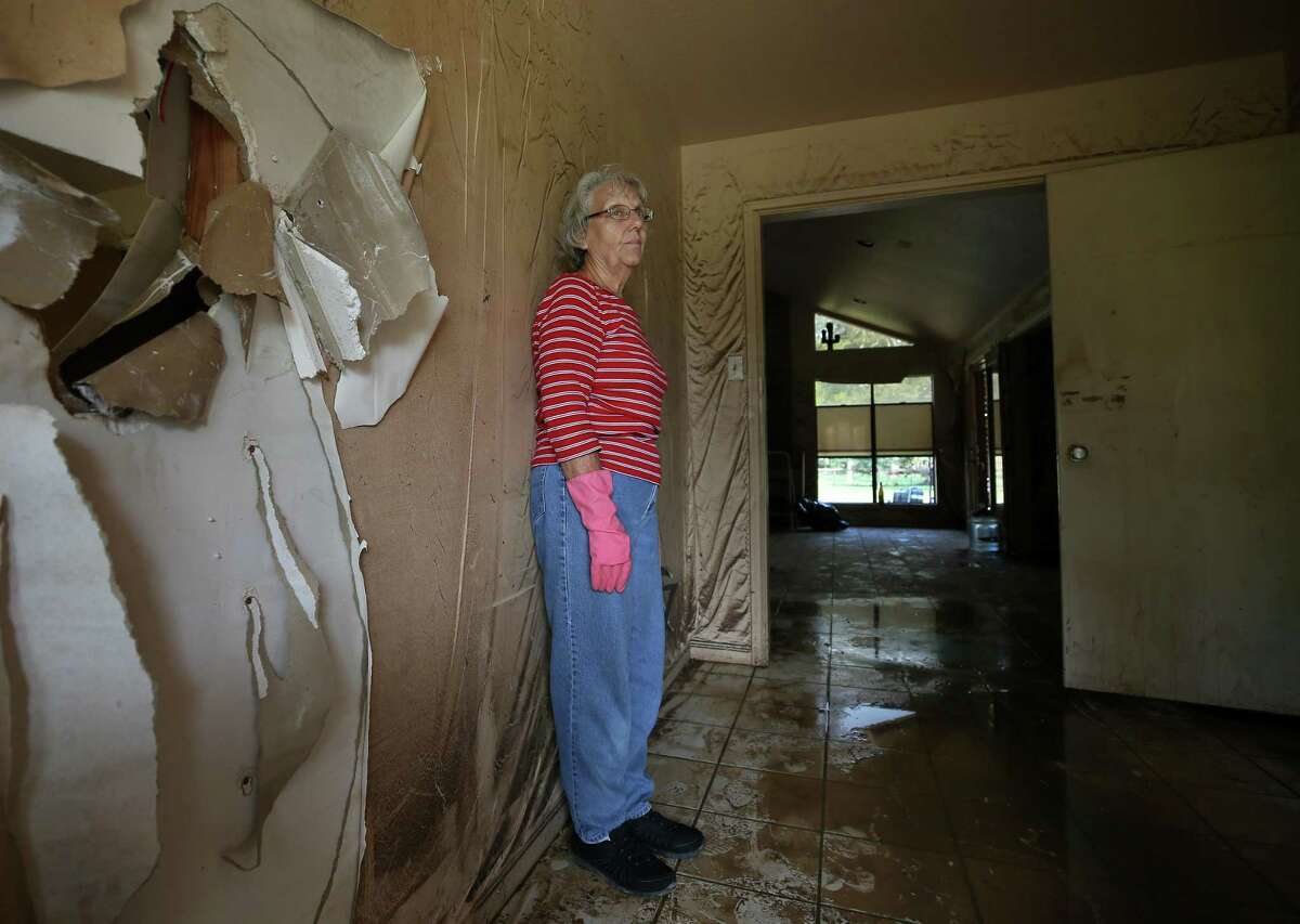 Linda Holmes seen on the entrance hallway of her home, damaged from flooding caused by Hurricane Harvey, Thursday, Sept. 14, 2017, in Wharton, Texas. ( Godofredo A. Vasquez / Houston Chronicle )