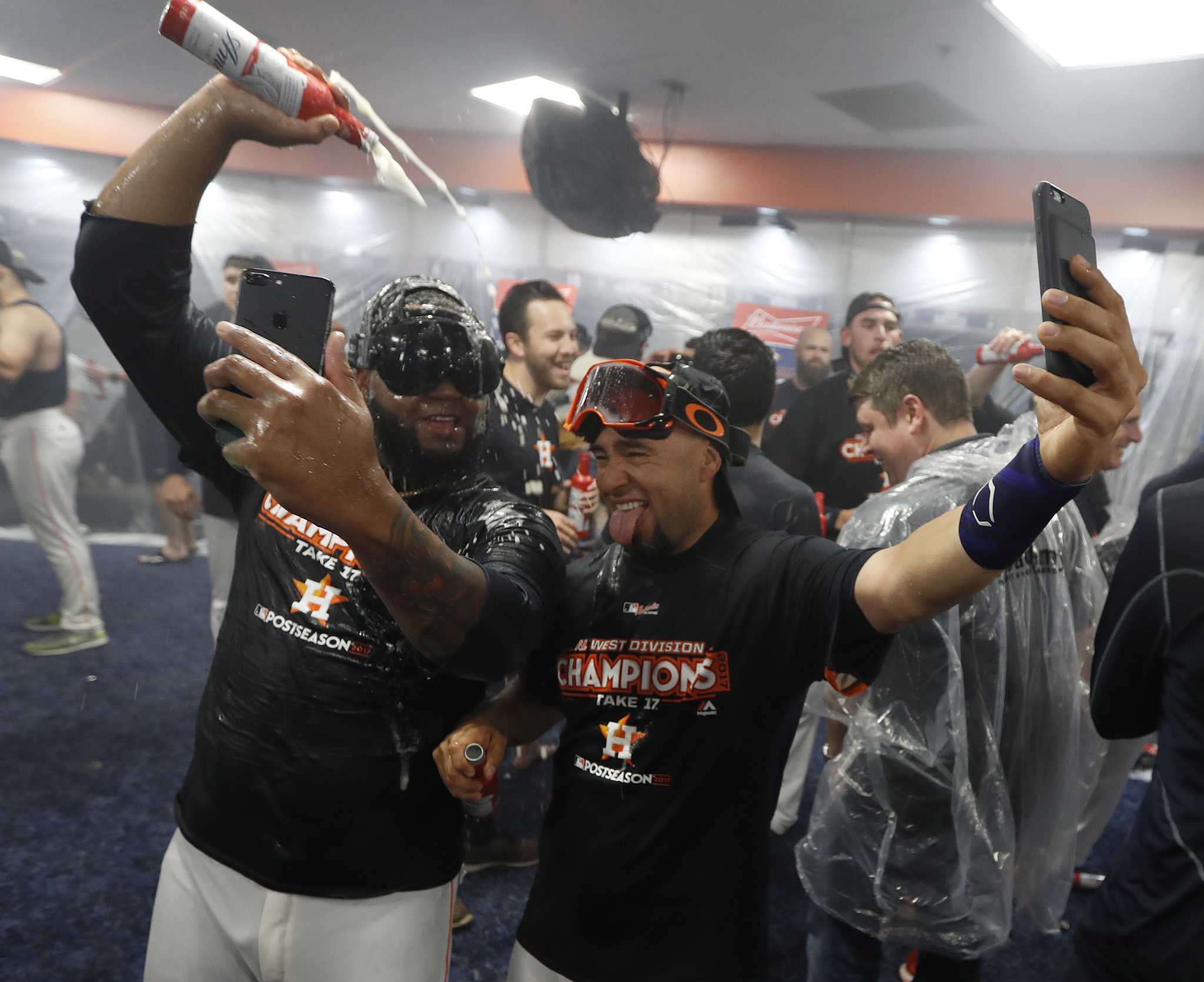 Dozier's shirt has a picture of him guzzling booze in the locker room after  NLCS victory