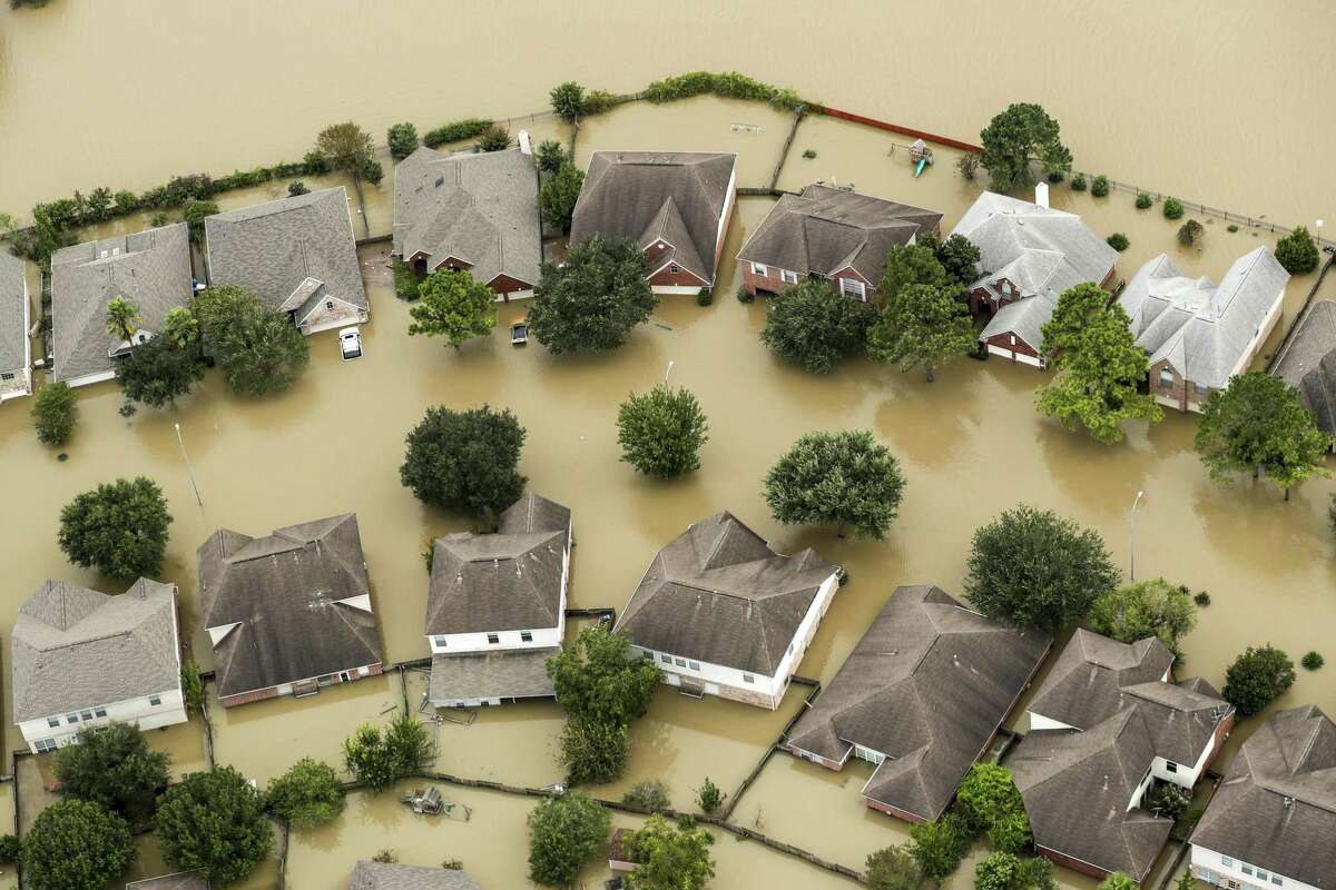 Floodwaters from the Addicks Reservoir inundate a neighborhood off N. Eldridge Parkway in the aftermath of Tropical Storm Harvey on Wednesday, Aug. 30, 2017, in Houston. (Brett Coomer/Houston Chronicle via AP)