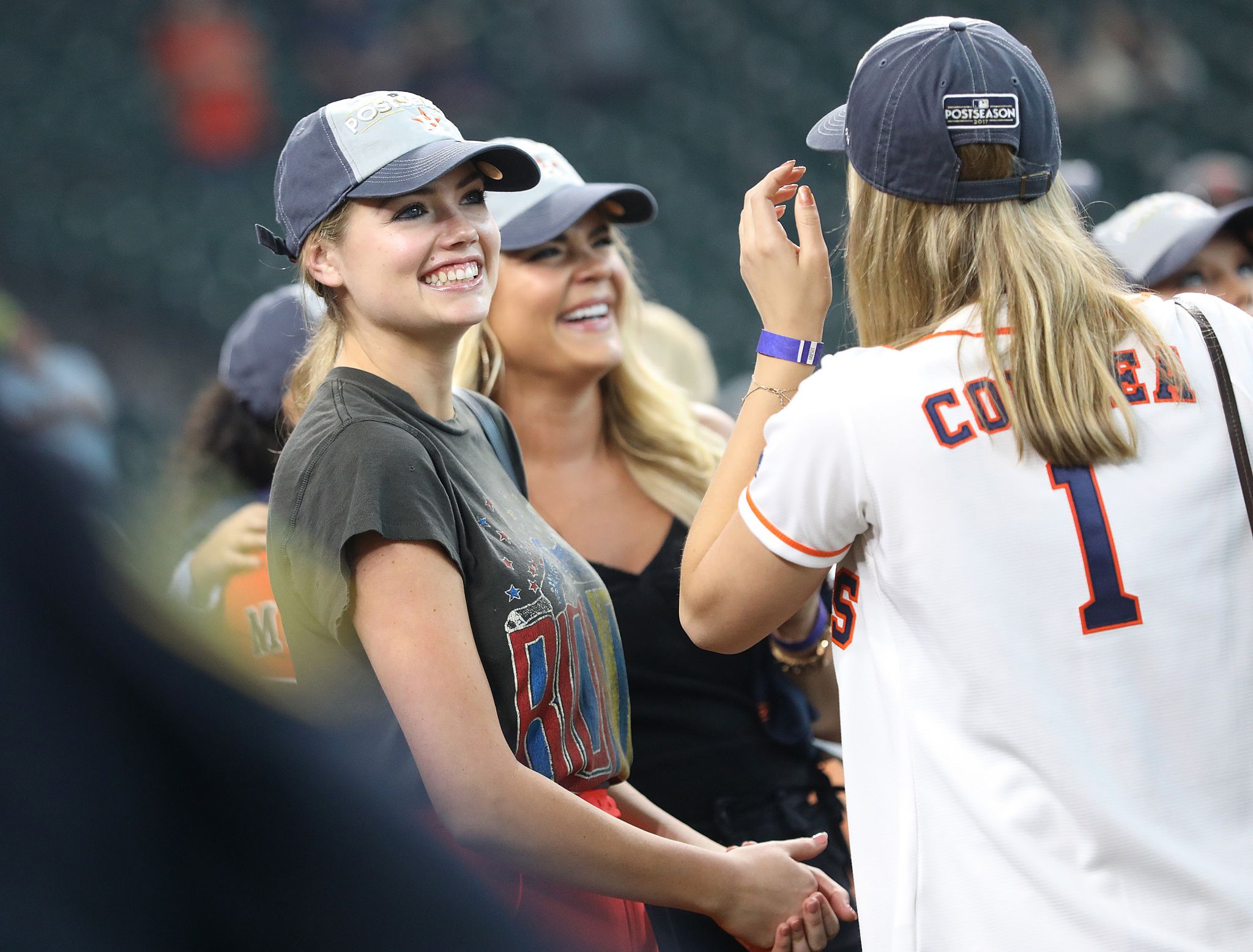 Kate Upton cheers for the Yankees in tiny white shorts and can't help but  pose up a storm in the stands