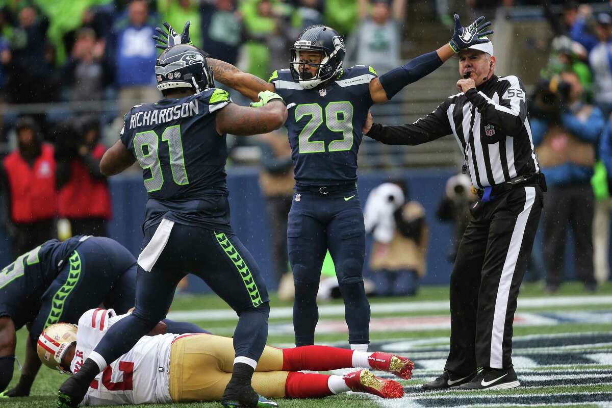 Seahawks safety Earl Thomas and defensive lineman Sheldon Richardson celebrate after Seahawks defensive lineman Frank Clark sacked 49ers quarterback Brian Hoyer on the 49ers 1-yard line during the second half of Seattle's game against San Francisco, Sunday, Sept. 17, 2017.