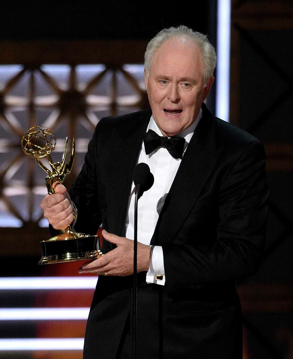 John Lithgow accepts the award for outstanding supporting actor in a drama series for "The Crown" at the 69th Primetime Emmy Awards on Sunday, Sept. 17, 2017, at the Microsoft Theater in Los Angeles. (Photo by Chris Pizzello/Invision/AP)