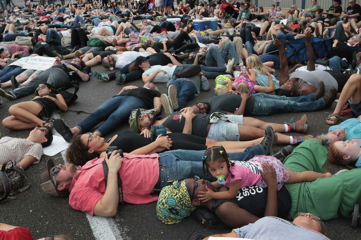 ST LOUIS, MO - SEPTEMBER 17: Demonstrators protesting the acquittal of former St. Louis police officer Jason Stockley stage a die-in in front of police headquarters on September 17, 2017 in St. Louis, Missouri. This is the third day of protests in the city following the acquittal of Stockley, who had been charged with first-degree murder last year following the 2011 on-duty shooting of Anthony Lamar Smith. (Photo by Scott Olson/Getty Images)