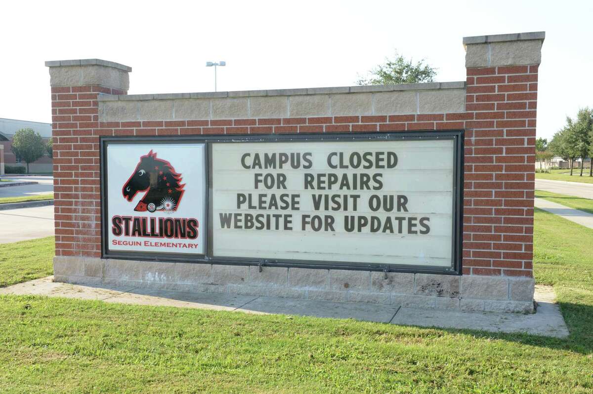 Sign indicating Ft. Bend ISD's Seguin Elementary School in Richmond, TX is closed while repairs from flood damage are completed. September 12, 2017.